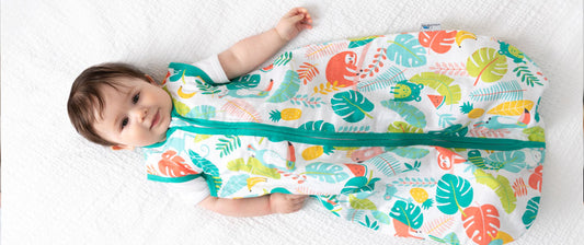 baby in cot in summer sleeping bag