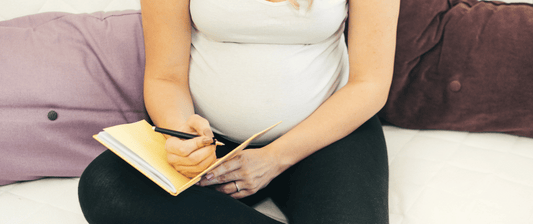 pregnant woman writing list