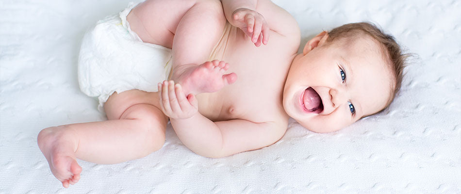 baby rolling over and laughing