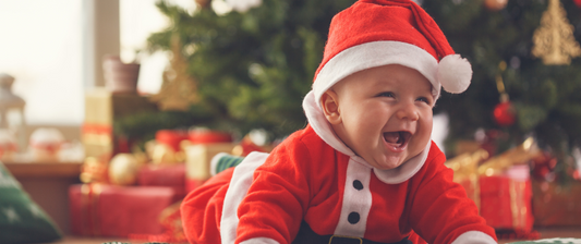 baby in father christmas outfit