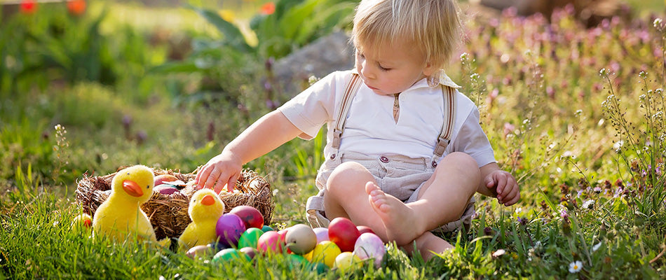 toddler with easter eggs