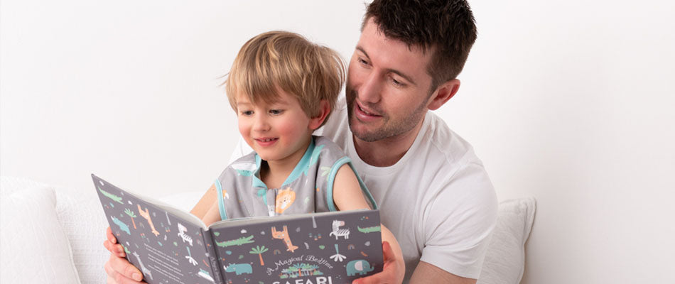 dad with boy reading book