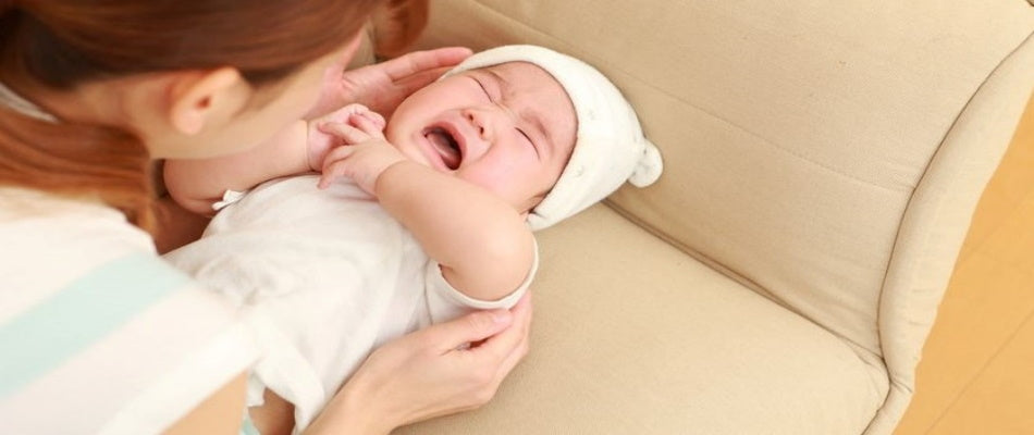 mum waking baby and baby crying